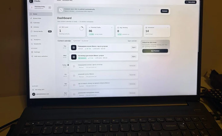 Clodix dashboard on a laptop with a two-week content calendar and scheduled articles