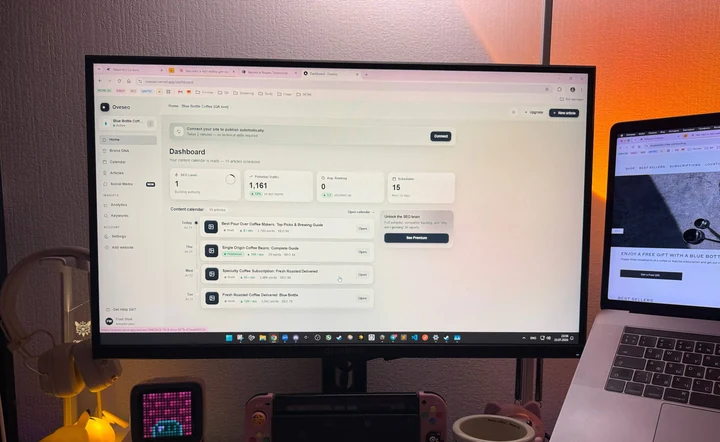 Clodix dashboard on a desktop monitor showing a content calendar of scheduled articles